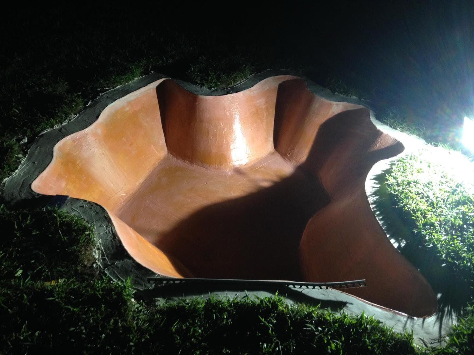 Custom decorative pond shell at night