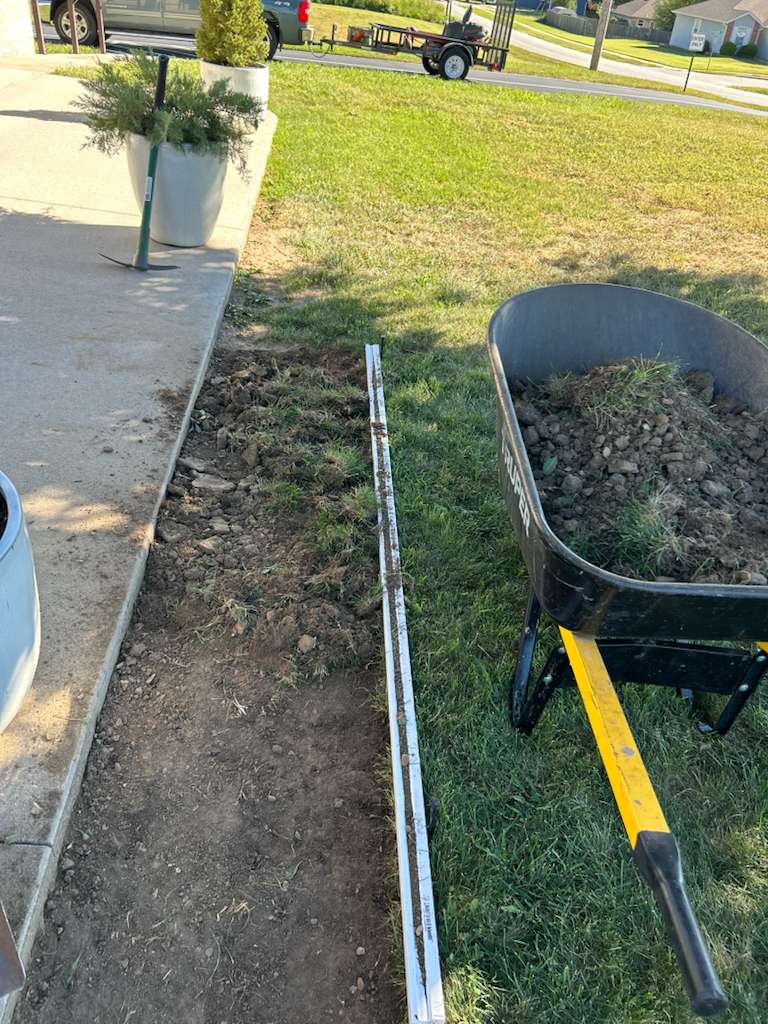 Landscaping work in progress with wheelbarrow